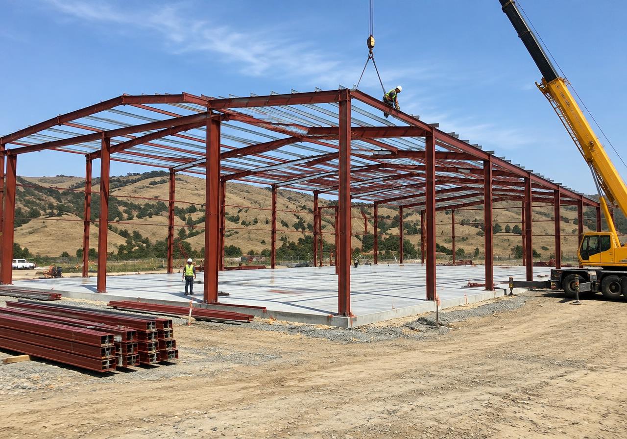 Pre-engineered metal building steel frames erected on a concrete slab